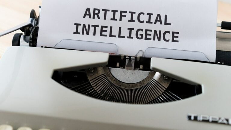 Artificial Intelligence (AI) typed on a typewriter