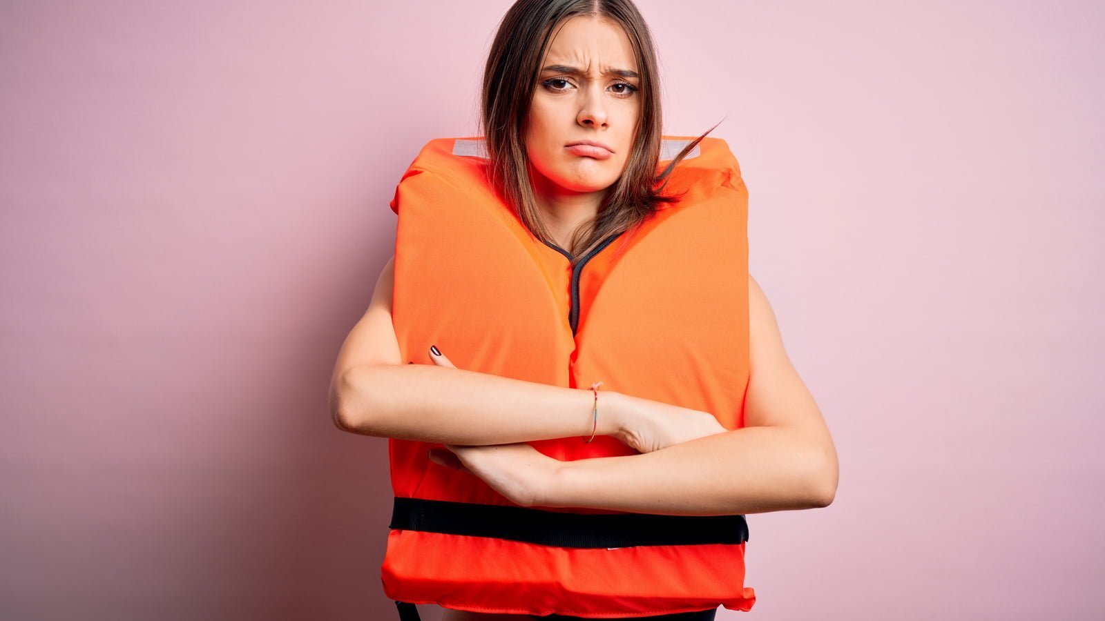 Woman wearing lifejacket.